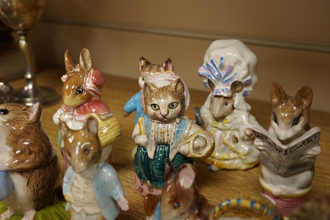 A collection of Beatrix Potter figures, three Staffordshire Dalmatians and a Copenhagen Dalmatian, tallest 16cm high